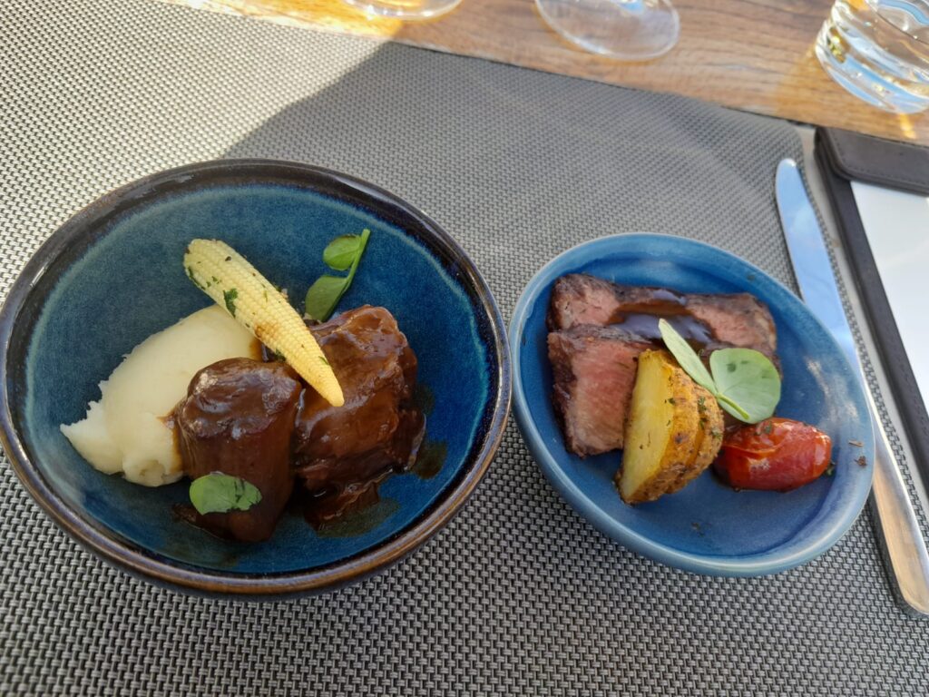 Main course rich wine braised oxtail and chalmar beef rib eye